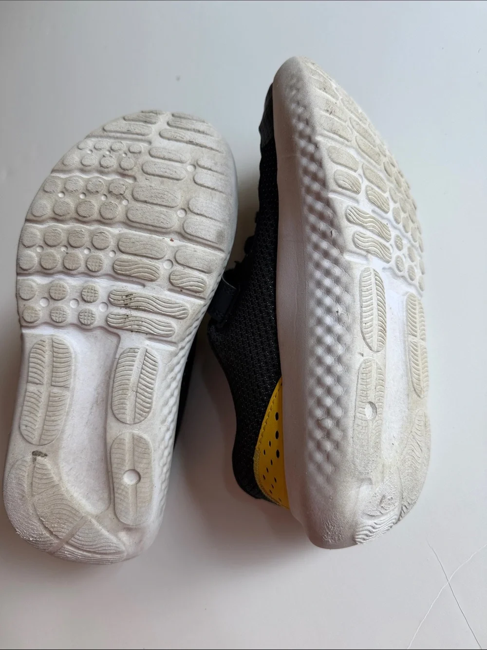 Under Armour Black and White Kids' Athletic Sneakers with Gold Logo